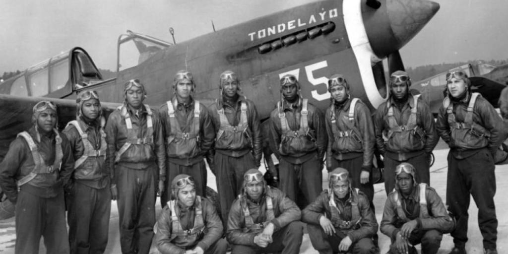 Tuskegee Airmen with military aircraft